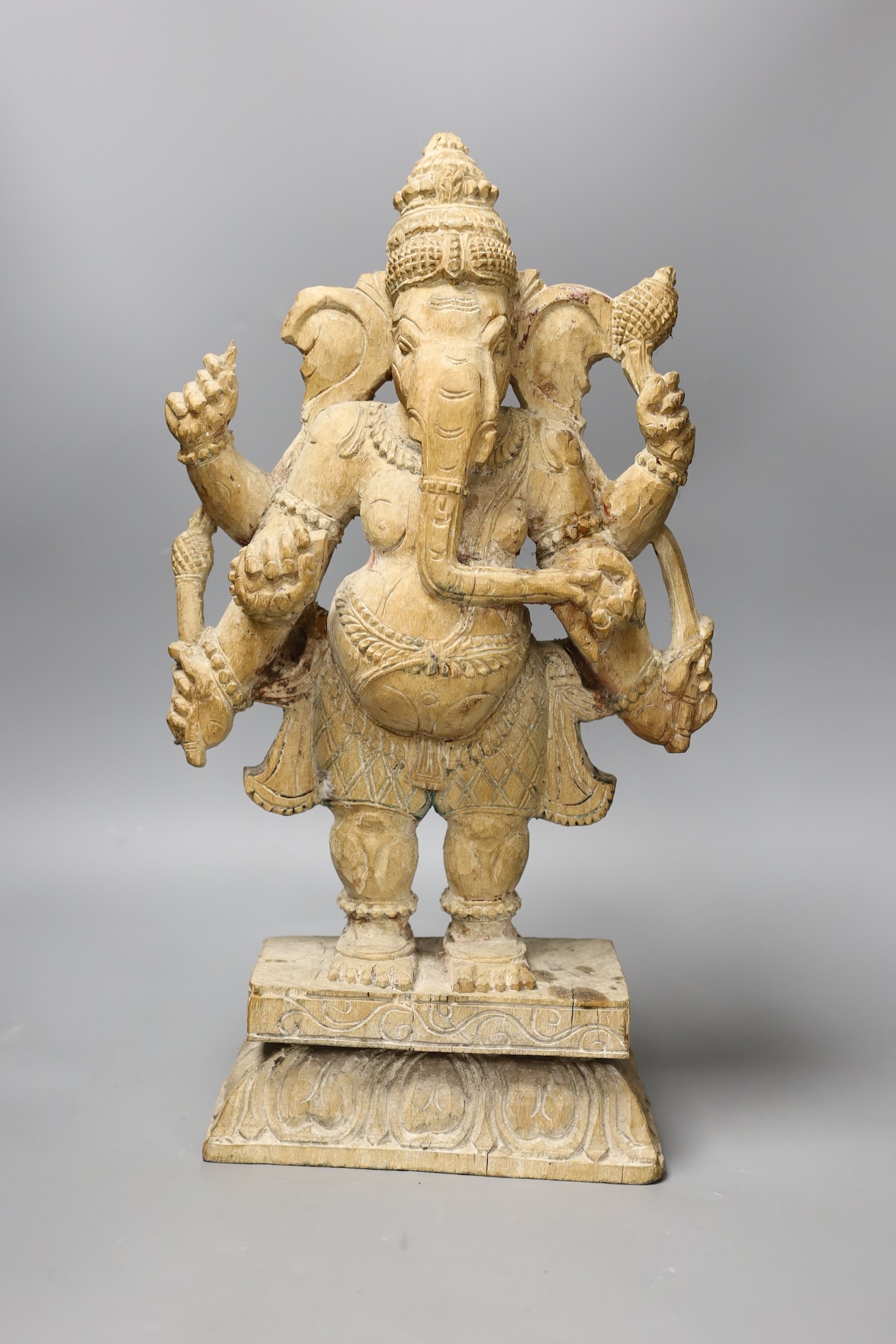 An Indian carved wood figure of Ganesha, 46cm tall